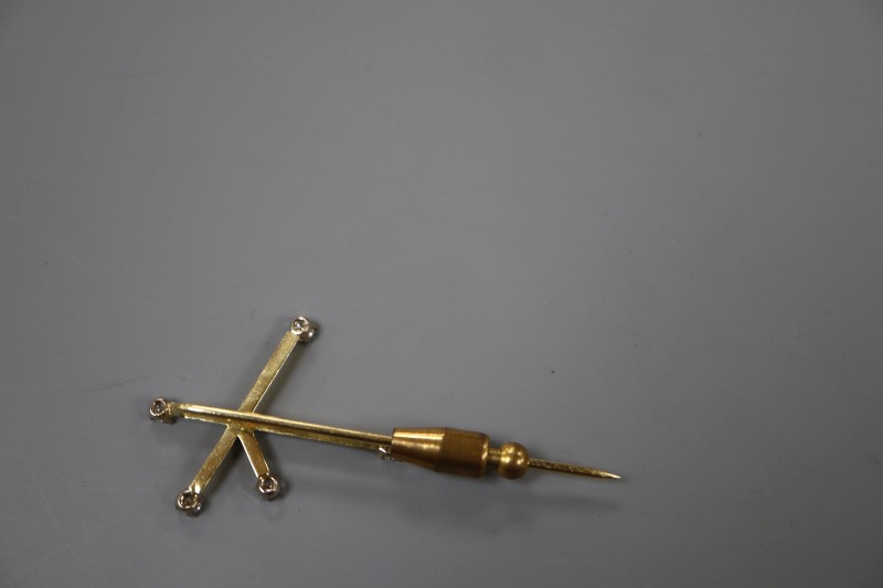 A 20th century yellow metal and diamond set Southern Cross constellation stick pin, 57mm, gross 4.9 grams.